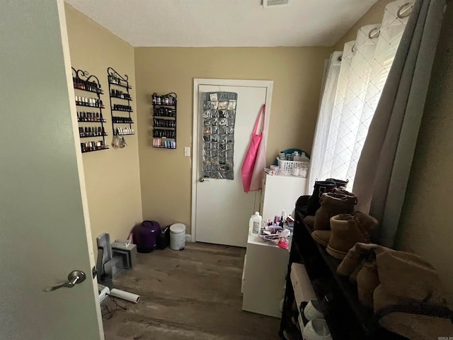 laundry room featuring wood-type flooring