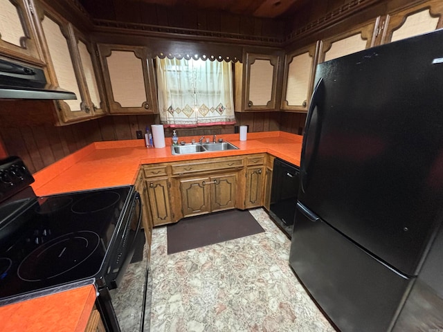 kitchen with tile flooring, sink, custom exhaust hood, and black appliances