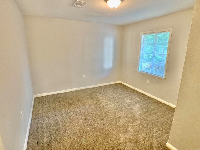 unfurnished room with carpet floors