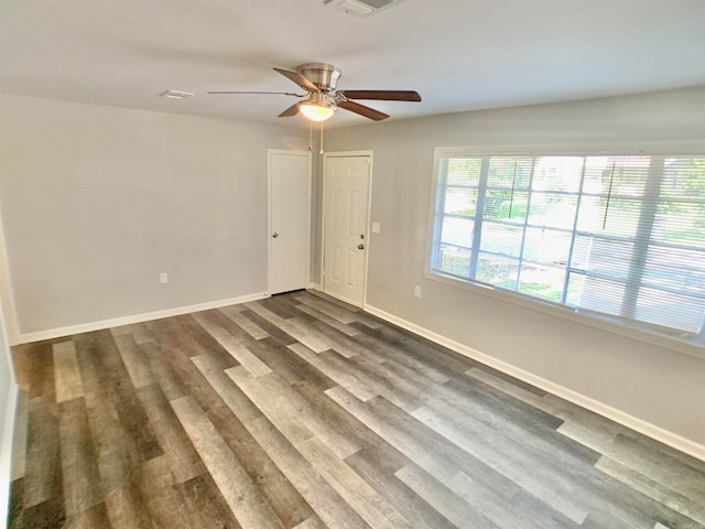 empty room featuring ceiling fan and hardwood / wood-style flooring