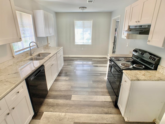 kitchen with black appliances, plenty of natural light, white cabinetry, and sink