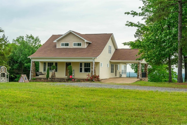 view of front facade with a front lawn and a carport