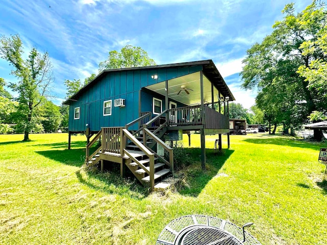 back of house with a yard and ceiling fan