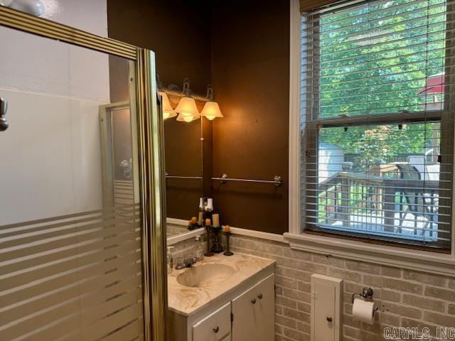 bathroom with a healthy amount of sunlight and vanity