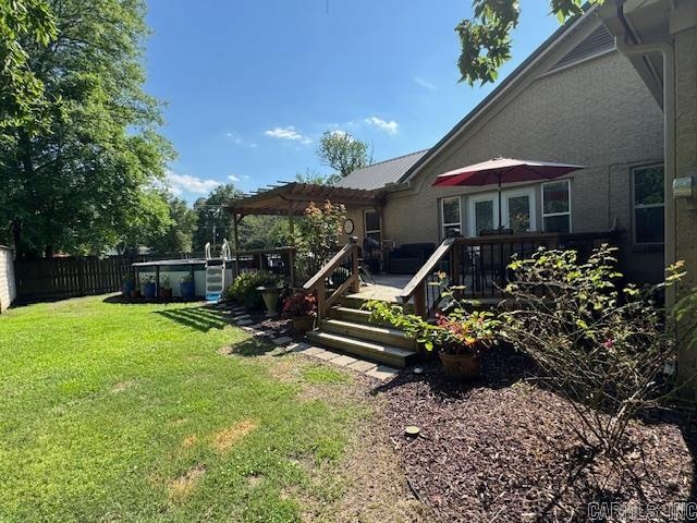 view of yard featuring a pergola and a wooden deck