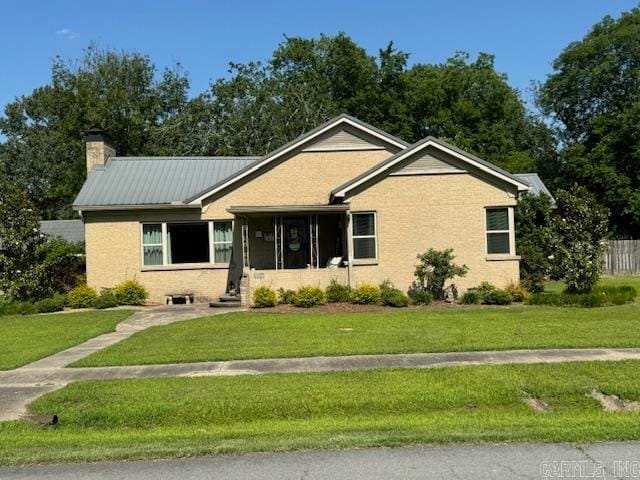 ranch-style home with a front lawn