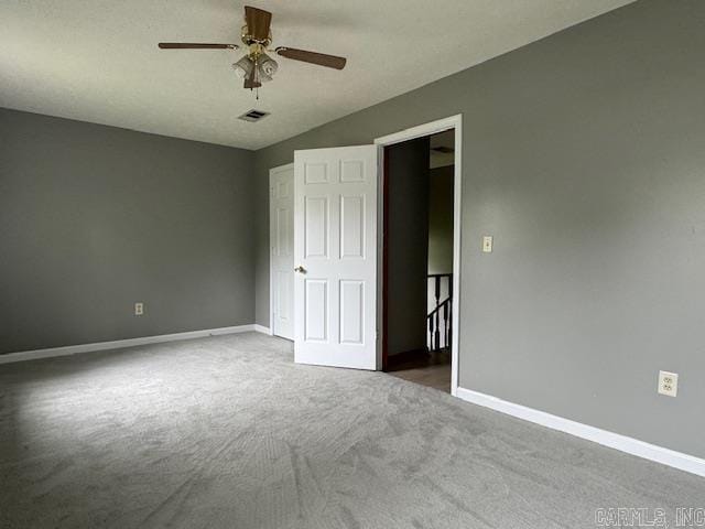 unfurnished bedroom with carpet flooring and ceiling fan