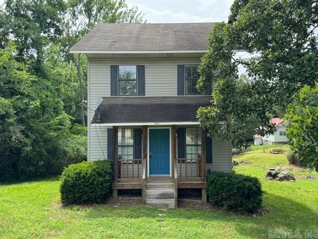 view of front facade with a front lawn and a porch