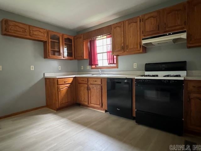 kitchen with light hardwood / wood-style floors, extractor fan, dishwasher, and white electric range oven