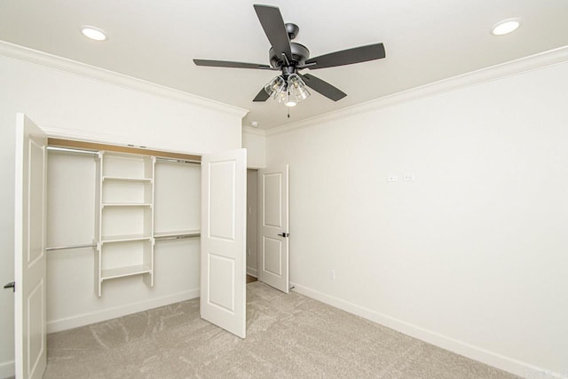 unfurnished bedroom with ceiling fan, a closet, and light carpet