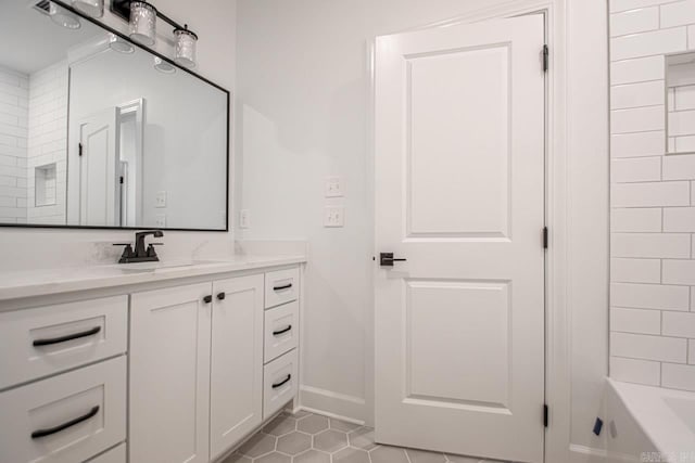 bathroom with tile floors, shower / washtub combination, and vanity