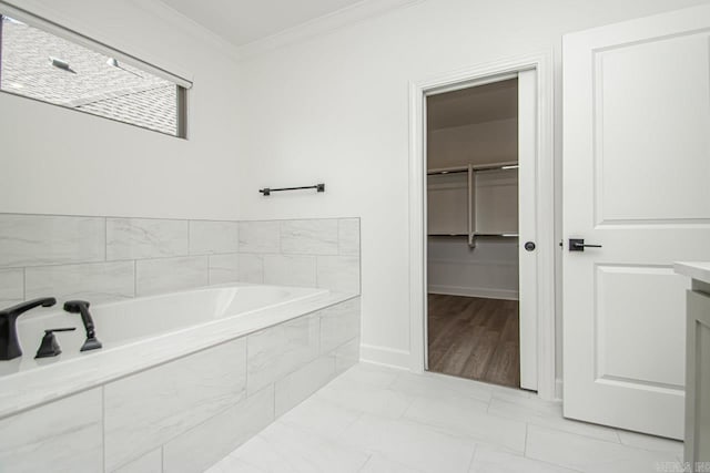 bathroom with a relaxing tiled bath, tile floors, and crown molding