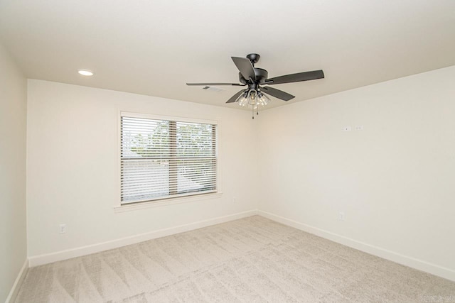 carpeted empty room with ceiling fan