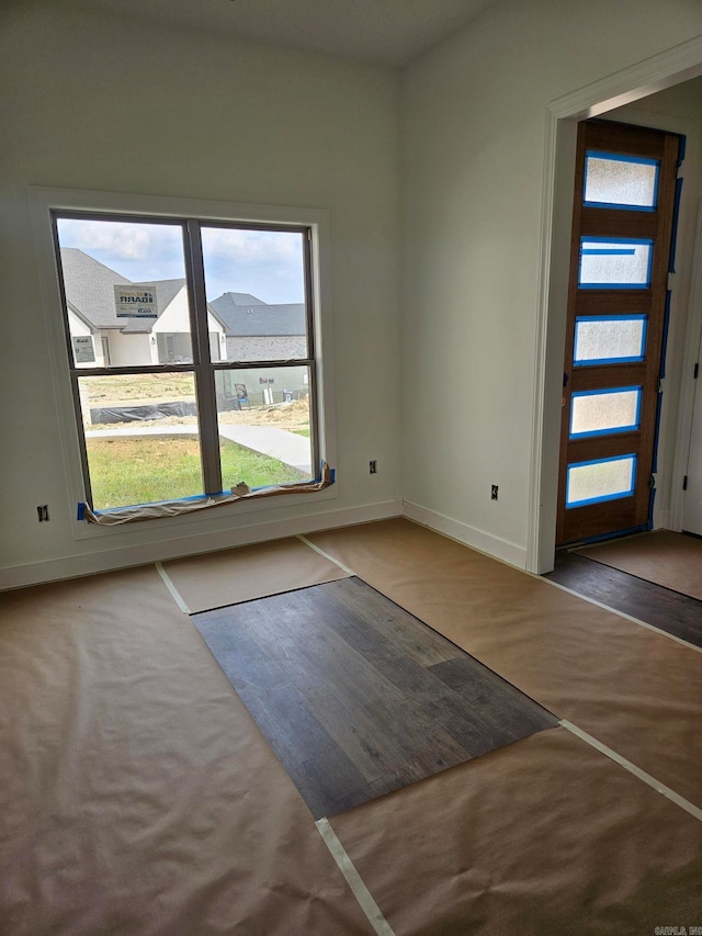 spare room with hardwood / wood-style floors