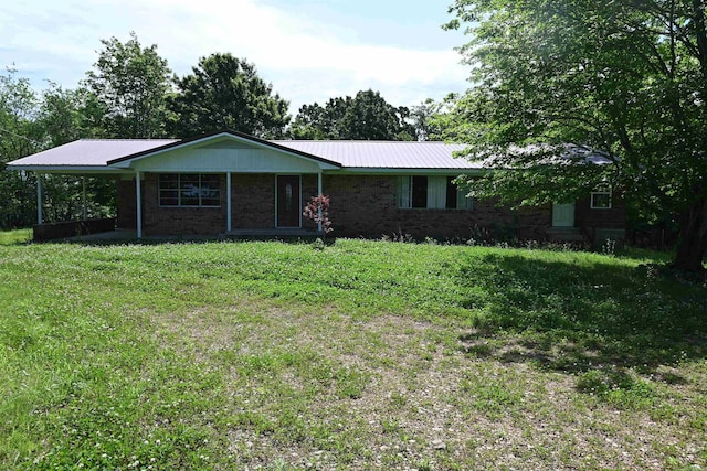 ranch-style house featuring a front lawn