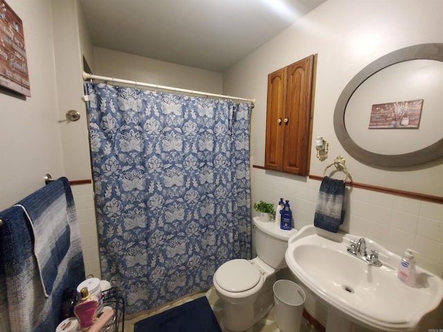 508 State St, Greenway, AR 72430 - full bathroom with a sink, toilet, tile walls, a shower with shower curtain, and a wainscoted wall
