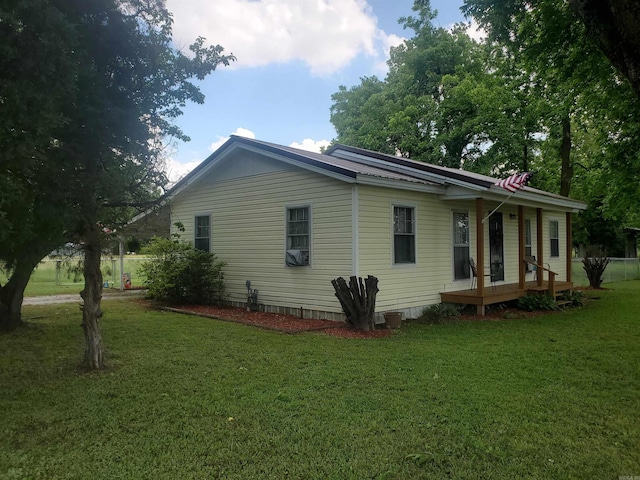 508 State St, Greenway, AR 72430 - view of side of property featuring a lawn and covered porch