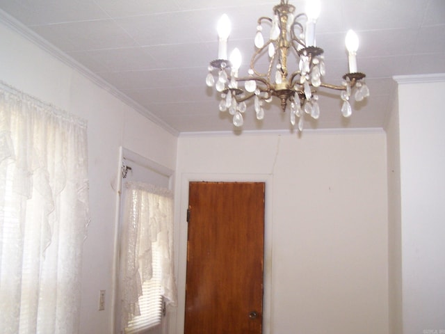 details featuring a notable chandelier and ornamental molding