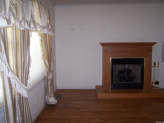 unfurnished living room with dark hardwood / wood-style flooring