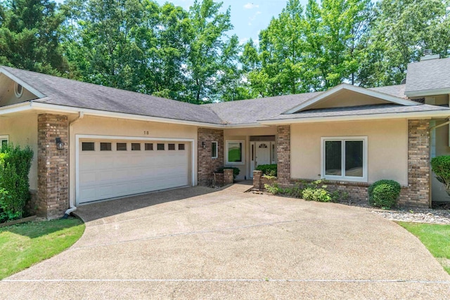 ranch-style home featuring a garage