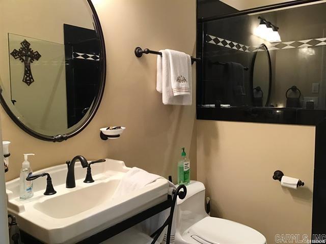 bathroom featuring toilet and sink
