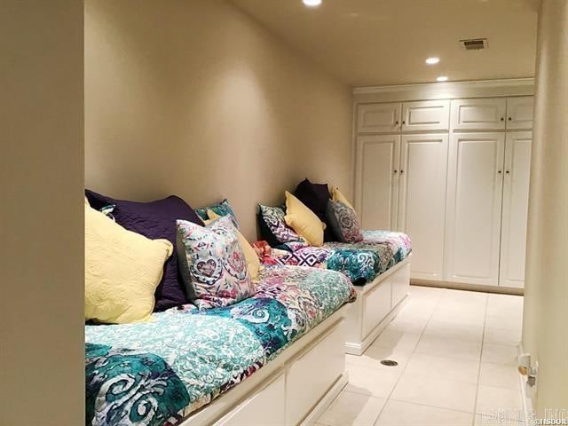 mudroom with light tile patterned floors