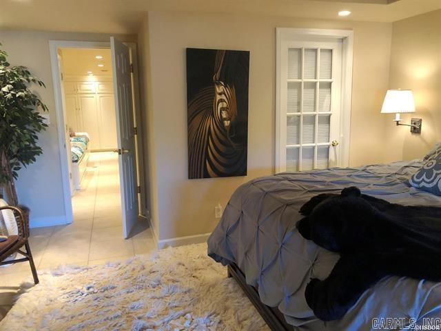 bedroom with light tile patterned flooring