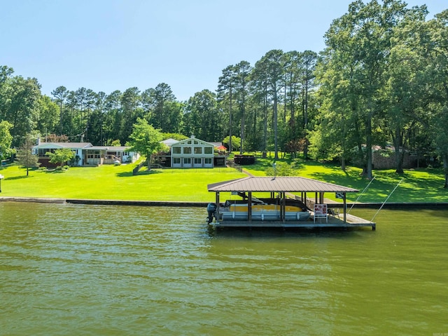view of dock with a water view and a yard