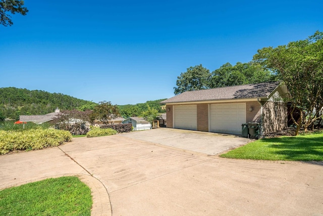 exterior space with a garage and an outdoor structure