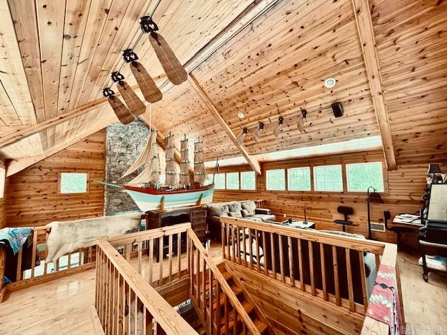 interior space with wood walls, hardwood / wood-style flooring, and wood ceiling