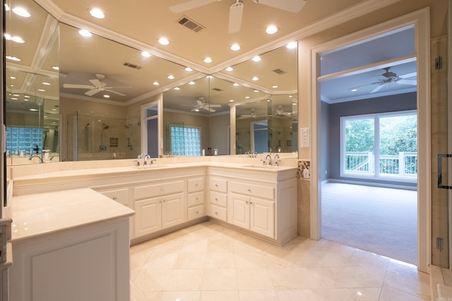 bathroom with tile floors, a shower with shower door, ceiling fan, and double vanity