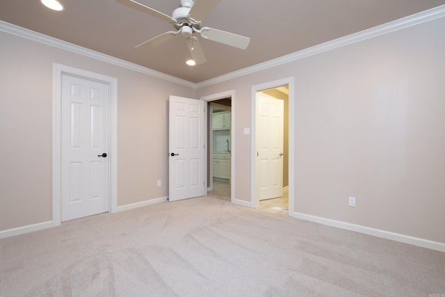 unfurnished bedroom with light carpet, ceiling fan, and crown molding