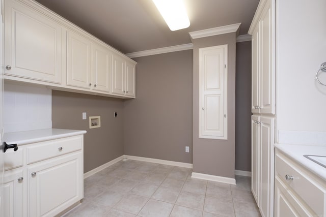 clothes washing area featuring ornamental molding, hookup for a washing machine, light tile floors, and electric dryer hookup