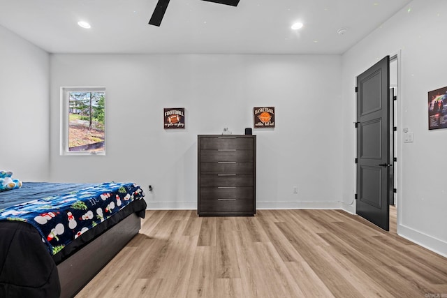 bedroom featuring ceiling fan and light hardwood / wood-style flooring