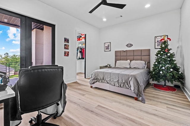 bedroom featuring light wood-type flooring and ceiling fan