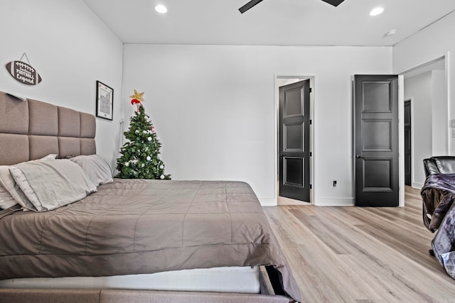 bedroom featuring ceiling fan and light hardwood / wood-style flooring