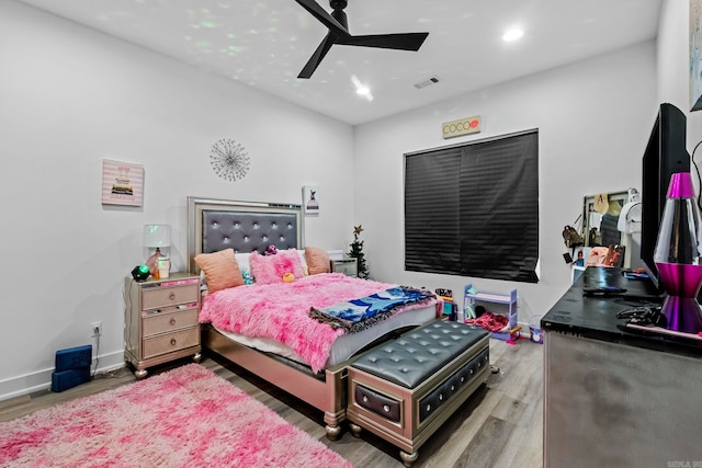 bedroom with hardwood / wood-style floors and ceiling fan