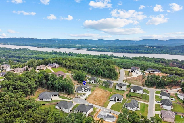 bird's eye view with a water and mountain view