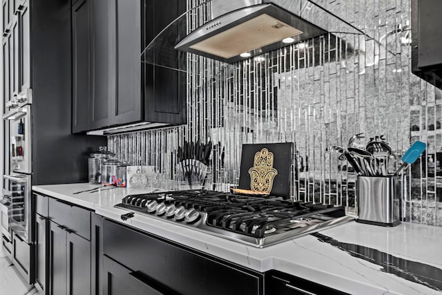 kitchen with tasteful backsplash and stainless steel gas cooktop