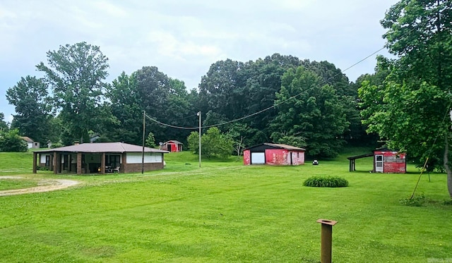 view of nearby features featuring an outdoor structure and a yard