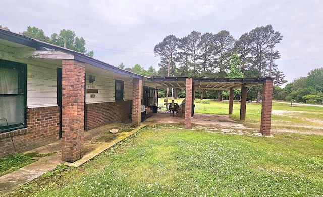 view of yard with a pergola and a patio area