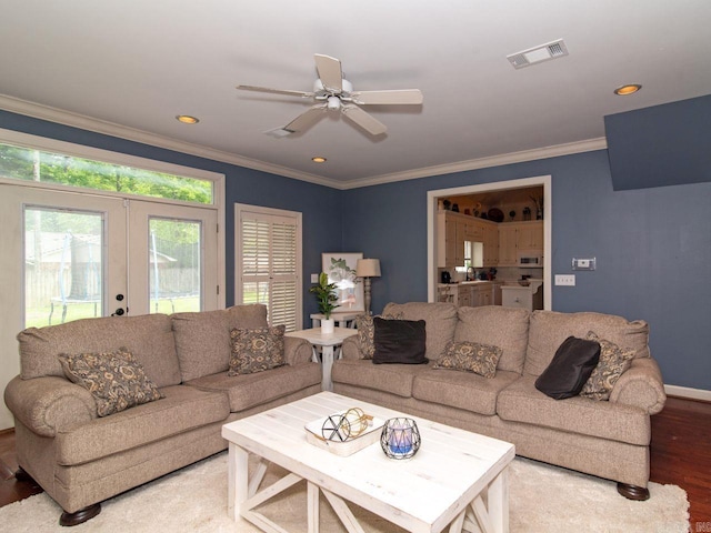 living room featuring hardwood / wood-style flooring, ceiling fan, ornamental molding, and french doors