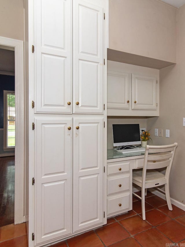 office space with dark tile patterned floors