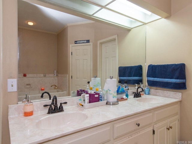 bathroom featuring vanity, crown molding, and a skylight