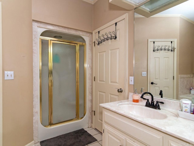 bathroom featuring tile patterned flooring, vanity, and an enclosed shower