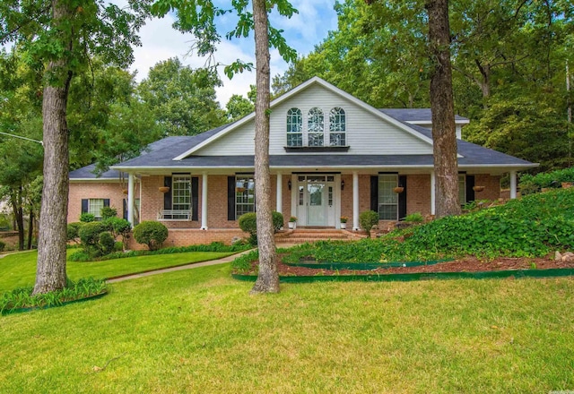 view of front of home featuring a porch and a front lawn