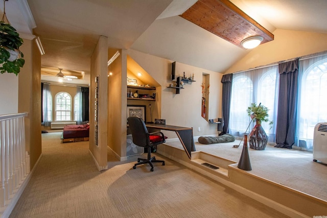 carpeted office space featuring ceiling fan, lofted ceiling, and a wealth of natural light