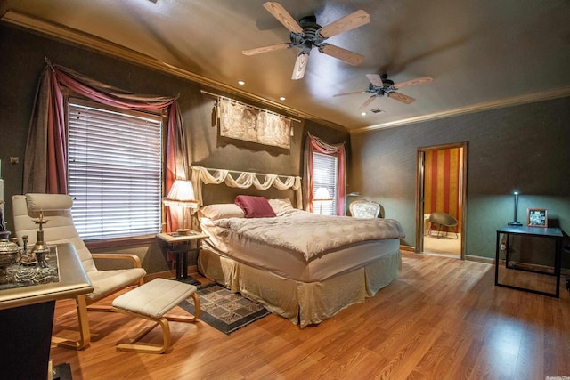 bedroom featuring wood-type flooring, ceiling fan, and ornamental molding