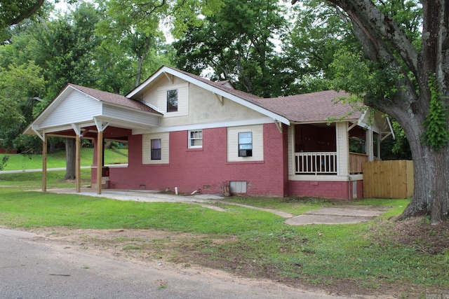bungalow-style home with brick siding, crawl space, and a patio area