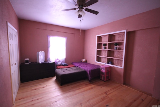 bedroom with wood finished floors and ceiling fan